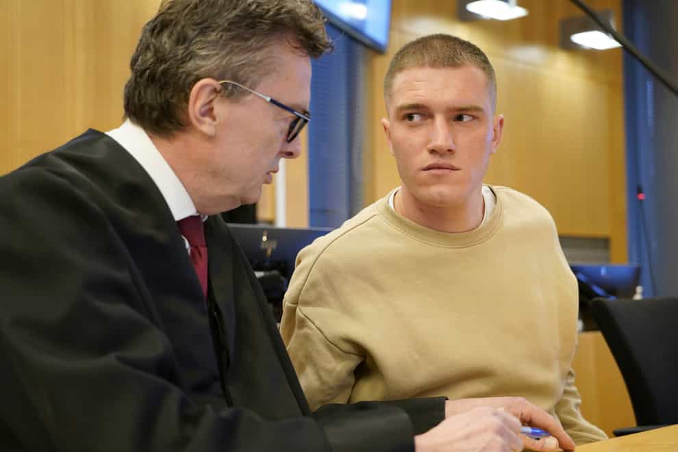 Former member of the Russian private military contractor Wagner Group Andrey Medvedev, right, listens to his lawyer Brynjulf Risnes during a court hearing in Oslo, on April 25, 2023 (Gorm Kallestad/NTB Scanpix via AP)