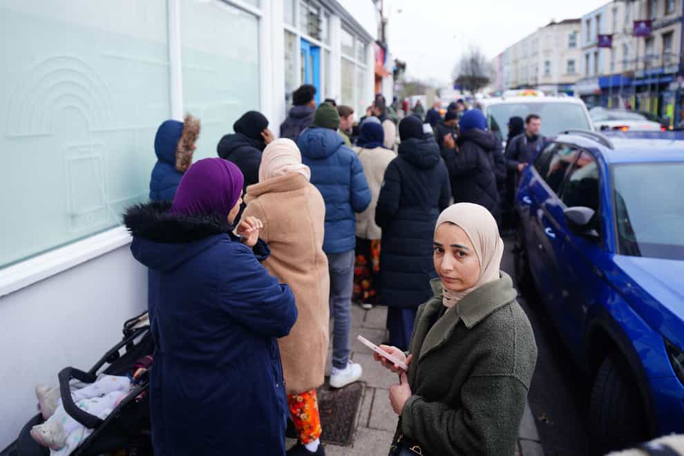 People in line outside the St Pauls Dental Practice in Bristol, which has opened registrations for NHS patients (Ben Birchall/PA)