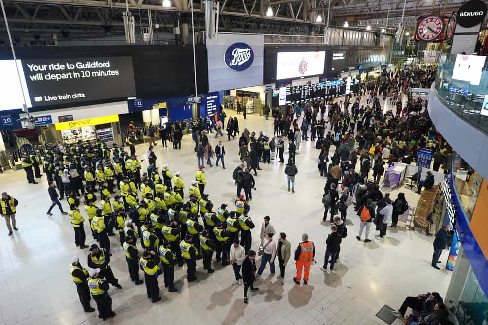 Police officers line up on the concourse (Stefan Rousseau/PA)