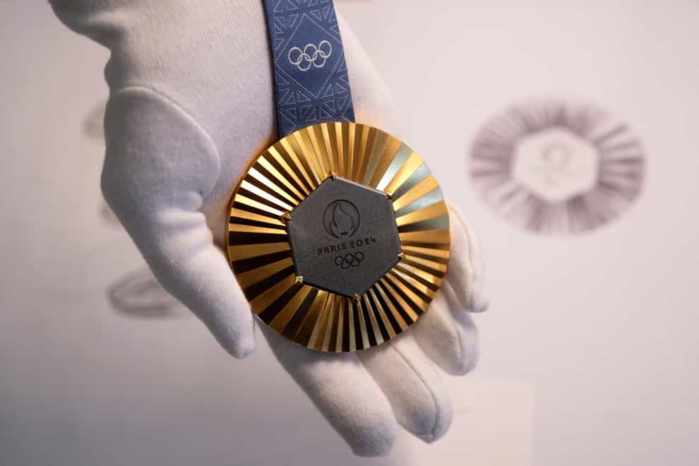 The Paris 2024 Olympic gold medal is presented to the press in Paris (Thibault Camus/AP)