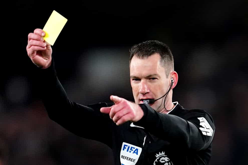 Referee Jarred Gillett shows a yellow card (Nick Potts/PA).