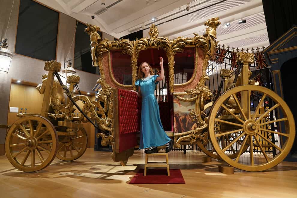 A reproduction of the Gold State Coach, which is part of the collection of more than 450 costumes, sets and props from the Netflix series The Crown (Lucy North/PA)
