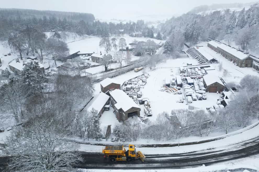 A snow plough clears the road in Allenheads, Northumberland (Owen Humphreys/PA)