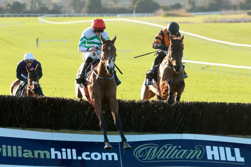 American Mike (centre) ridden by jockey Jack Kennedy on their way to winning the William Hill Ten Up Novice Chase (Damien Eagers/PA)