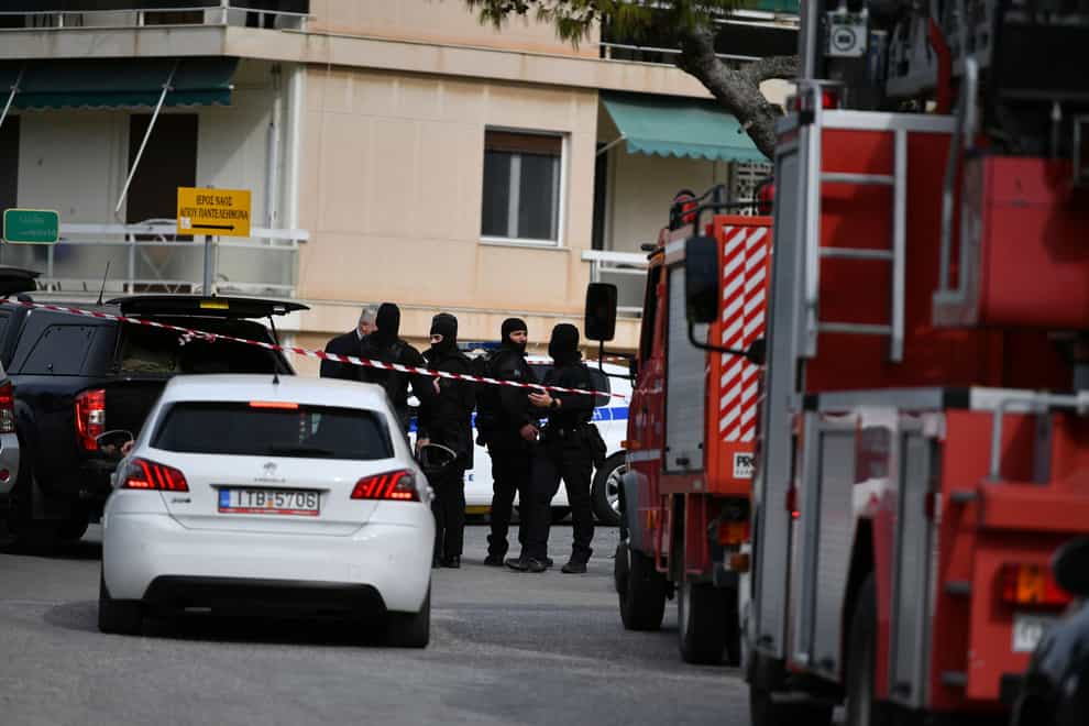 Police outside the ship compay offices in Glyfada, Athens, after the shooting (Michael Varaklas/AP)