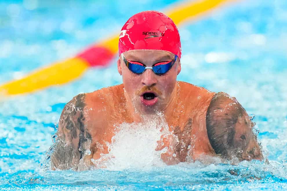 Adam Peaty in action at the World Championships in Doha (Hassan Ammar/AP)
