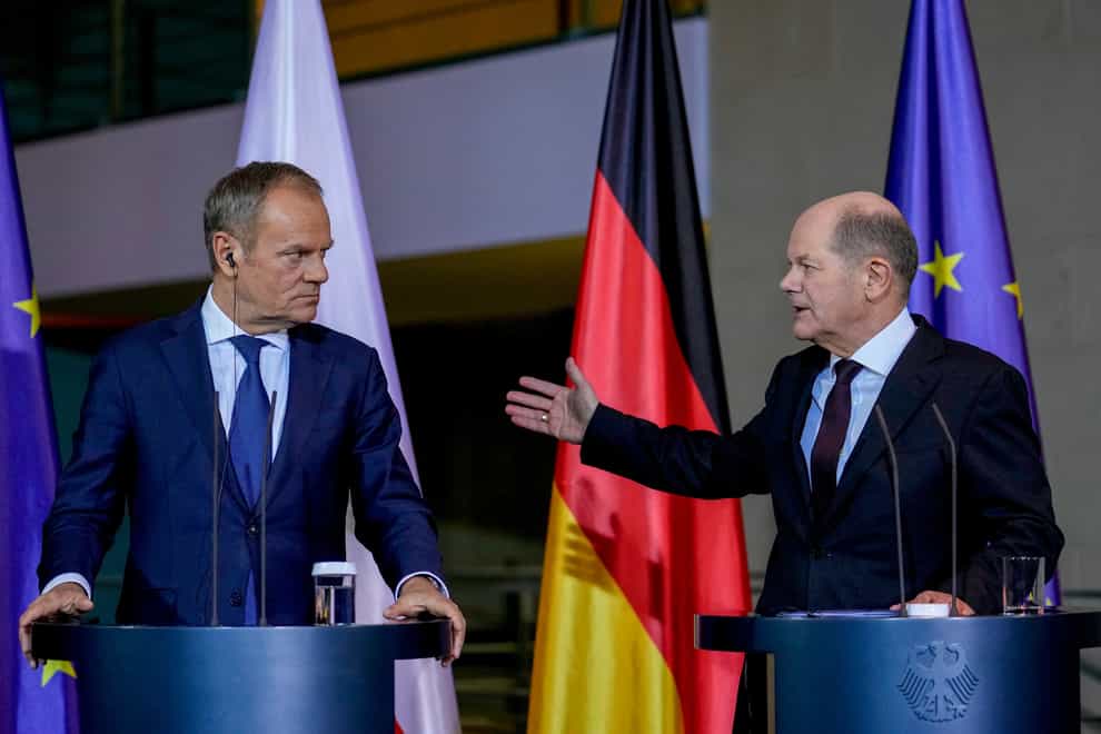 German chancellor Olaf Scholz, right, and Poland’s Prime Minister Donald Tusk attend a press conference in Berlin, Germany (Ebrahim Noroozi/AP)