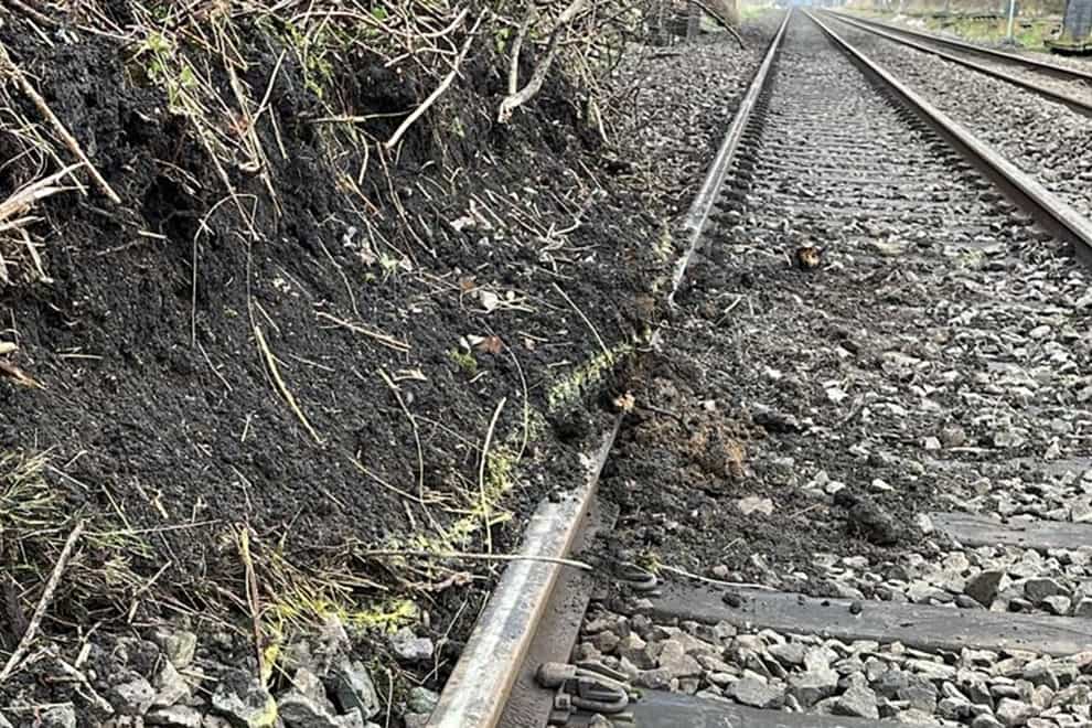 Tens of thousands of train passengers are suffering severe disruption as repairs are carried out following a landslip on one of the UK’s busiest rail routes (Network Rail/PA)