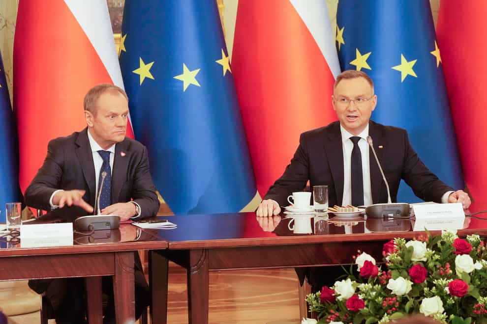 Poland’s Prime Minister Donald Tusk, left, and President Andrzej Duda attend a meeting of the Cabinet Council, a consultation format between the president and the government (Czarek Sokolowksi/AP)
