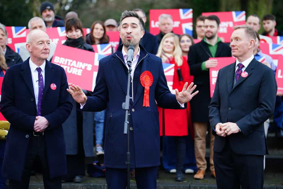 Newly elected Labour MP Damien Egan (centre) with Pat McFadden and Chris Bryant (right) surrounded by Labour supporters (Ben Birchall/PA)