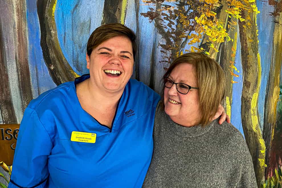 Sharon Woods, left, spotted her colleague Caroline Swan was showing signs of a stroke, and acted immediately to help her (NHSGGC/PA)