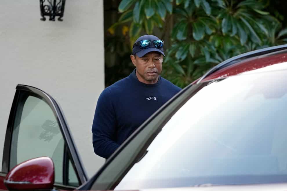 Tiger Woods gets into a vehicle after withdrawing from the Genesis Invitational golf tournament at Riviera Country Club (Ryan Sun/AP)