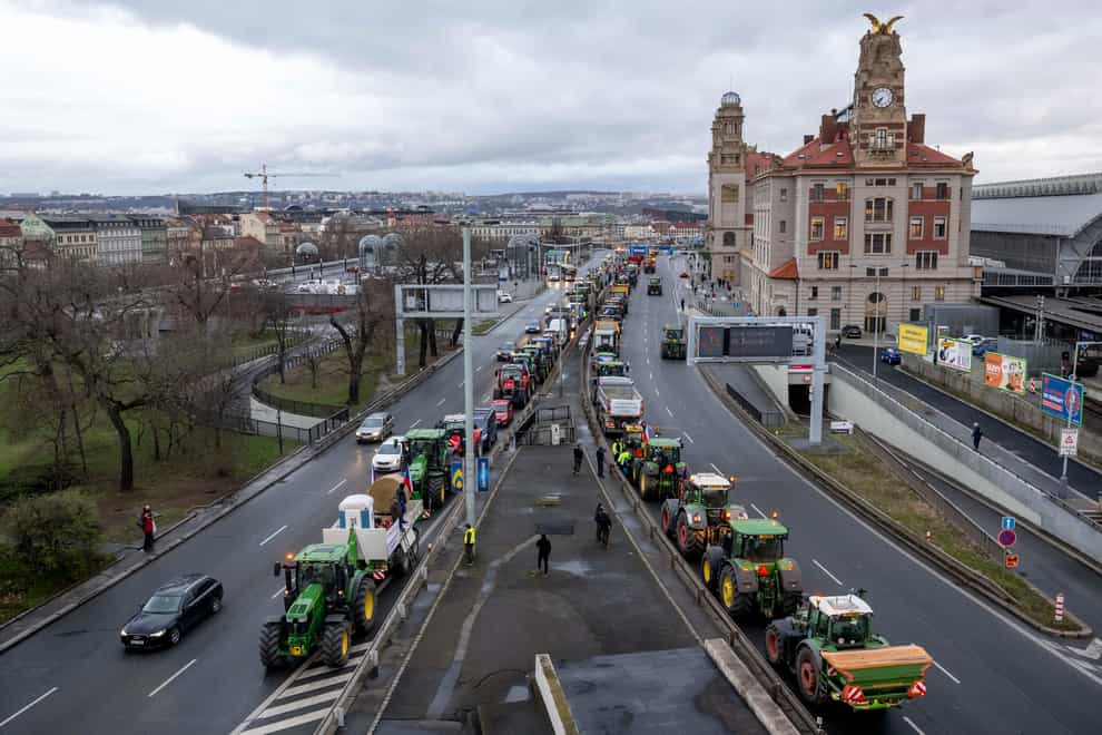 Farmers with tractors stand on a street in the centre of the Czech capital during a demonstration on Monday (Ondrej Deml/CTK via AP)