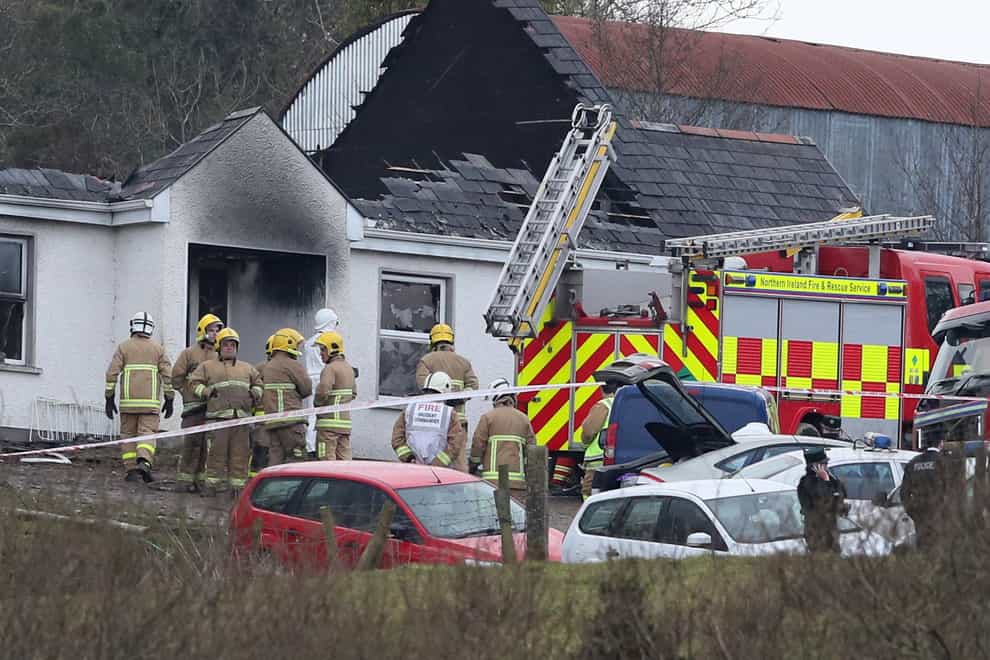 Firefighters a the scene of the fatal blaze in February 2018 (PA)