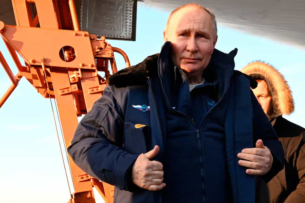 Vladimir Putin boarded the warplane at a snow-covered airfield (Dmitry Azarov, Sputnik, Kremlin Pool Photo via AP)