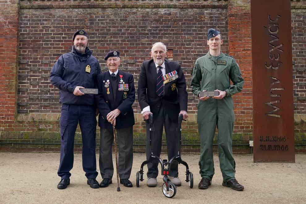 D-Day veterans Stan Ford, left, and John Roberts receive their memorial plaques during the commemorations for the 80th anniversary of D-Day in Portsmouth (Gareth Fuller/PA)