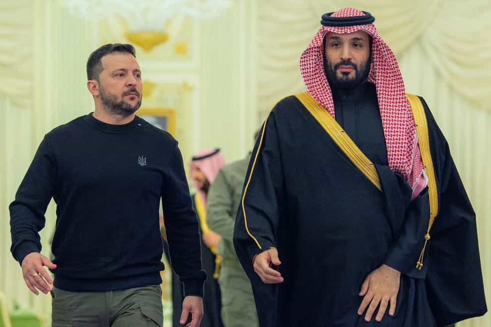 Saudi Crown Prince Mohammed bin Salman, right, accompanies President Volodymyr Zelensky at the Royal Palace in Riyadh (Bandar Aljaloud/Saudi Royal Palace via AP)
