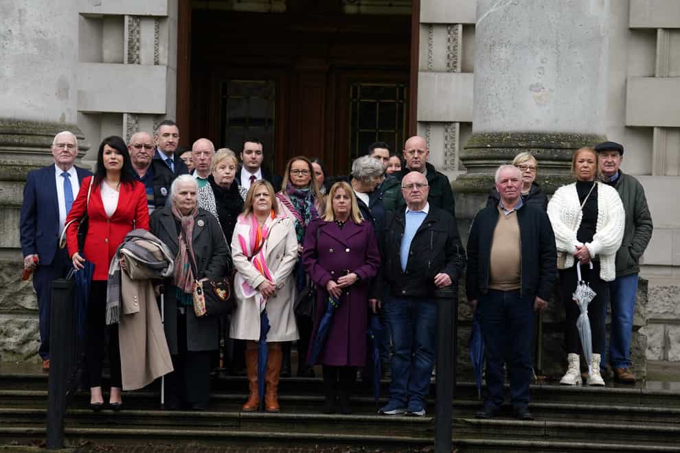 Grainne Teggart, Amnesty International UK’s Northern Ireland deputy director with victims’ families and supporters outside Belfast High Court ahead of the decision (Brian Lawless/PA)