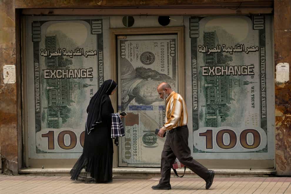 The Egyptian pound slipped sharply against the dollar after the Central Bank of Egypt raised its main interest rate and said it would allow the currency’s exchange rate to be set by market forces (AP)