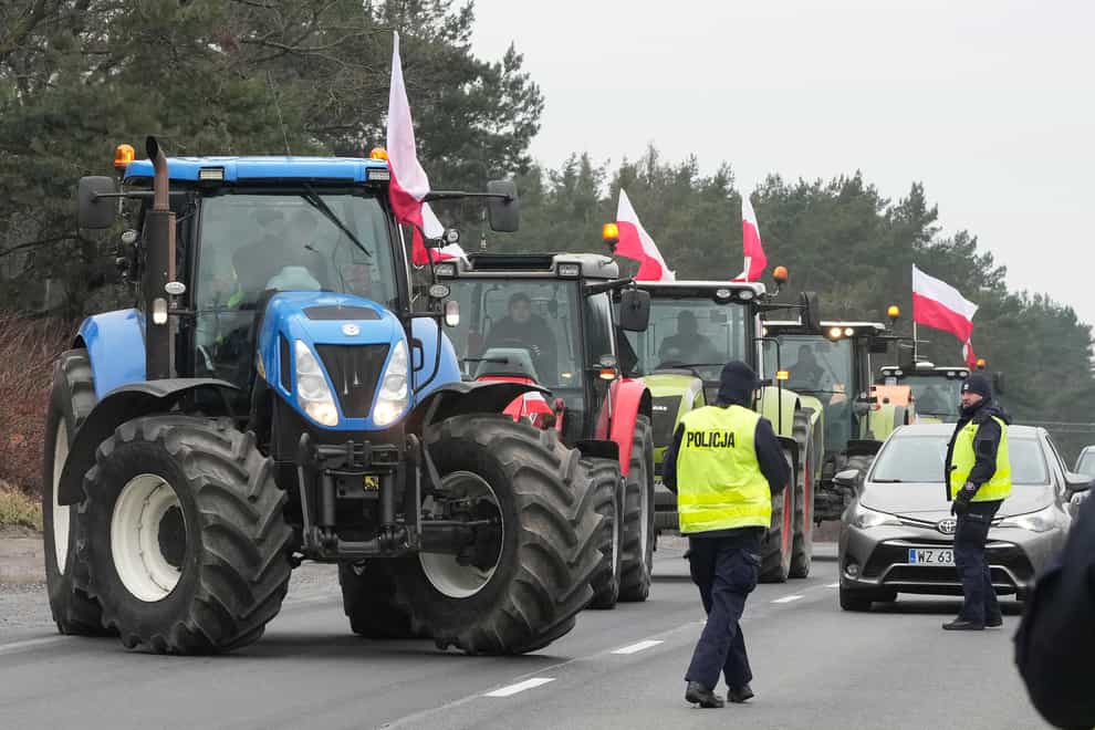 Polish farmers blocked major roads with tractors during the protest (AP)