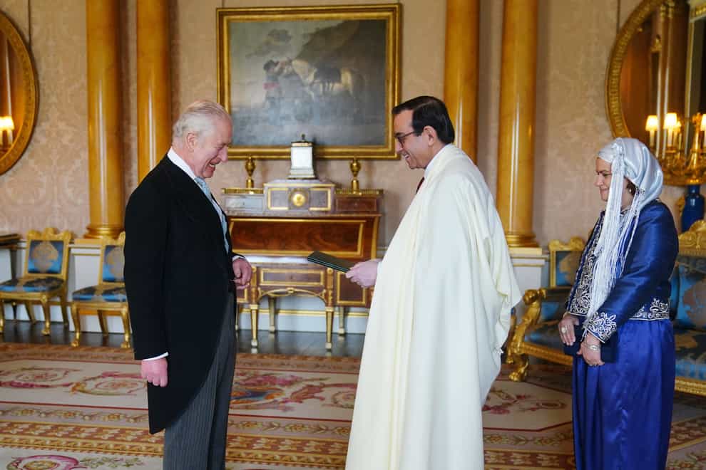 The ambassador of Algeria, Nourredine Yazid, accompanied by Ghaoutia Yazid, presents his credentials to the King (Victoria Jones/PA)