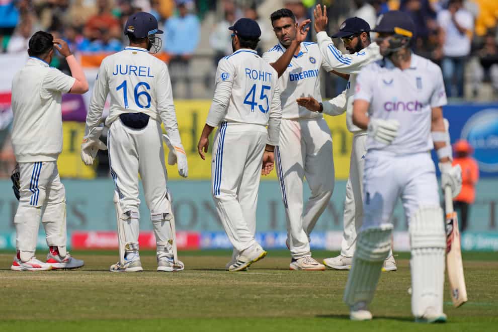 India’s Ravichandran Ashwin, third right, celebrates the wicket of Mark Wood (AP Photo/Ashwini Bhatia)