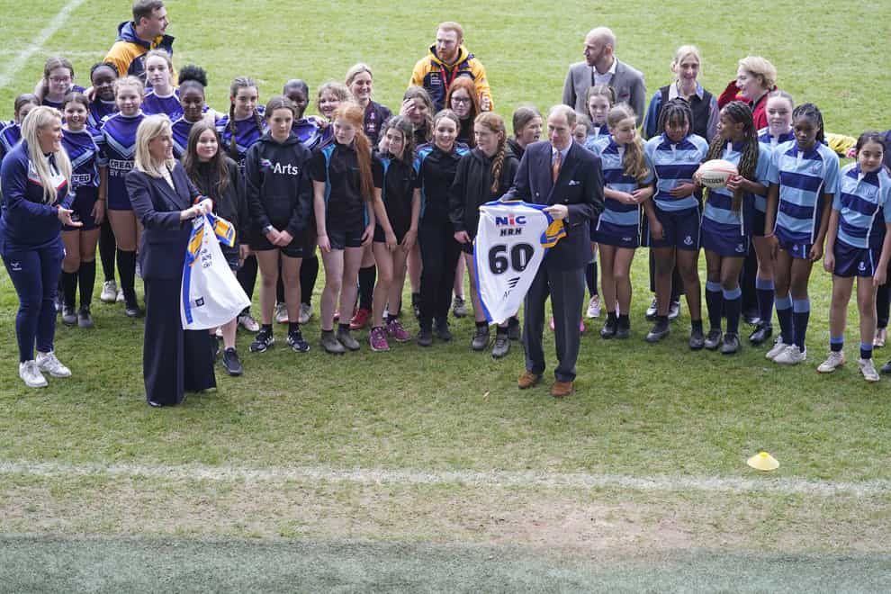 The Duke and Duchess of Edinburgh are presented with number 60 rugby shirts (Danny Lawson/PA)