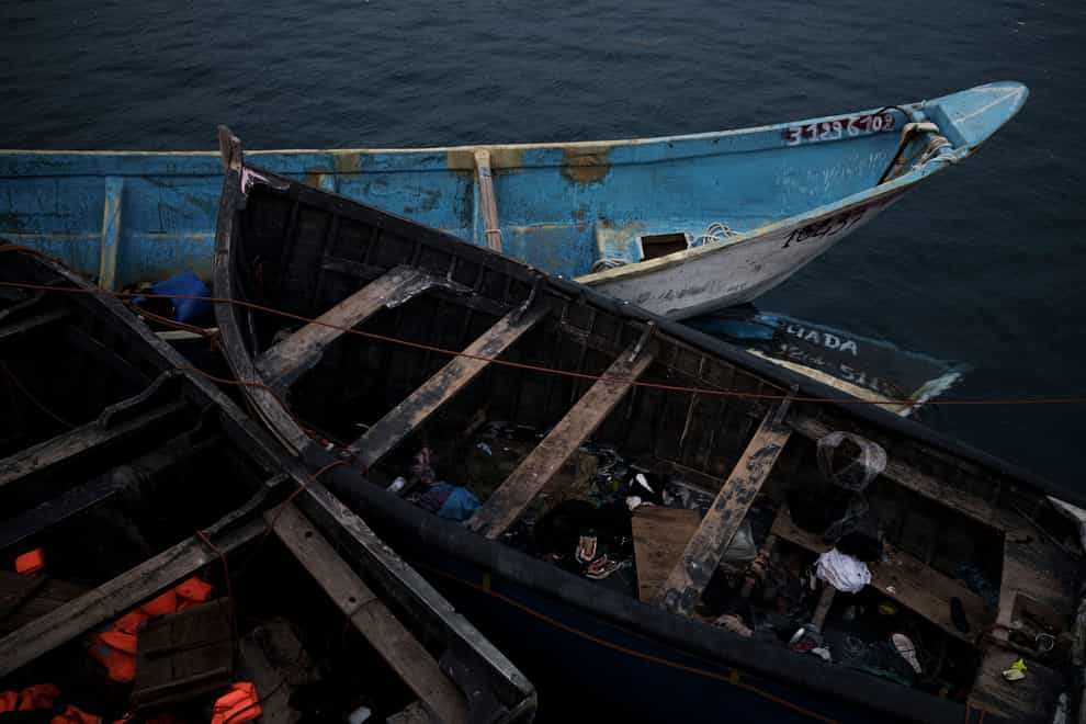 Empty boats used by migrants are moored at the port of Arguineguin in the Canary island of Gran Canaria, Spain (Felipe Dana/AP)