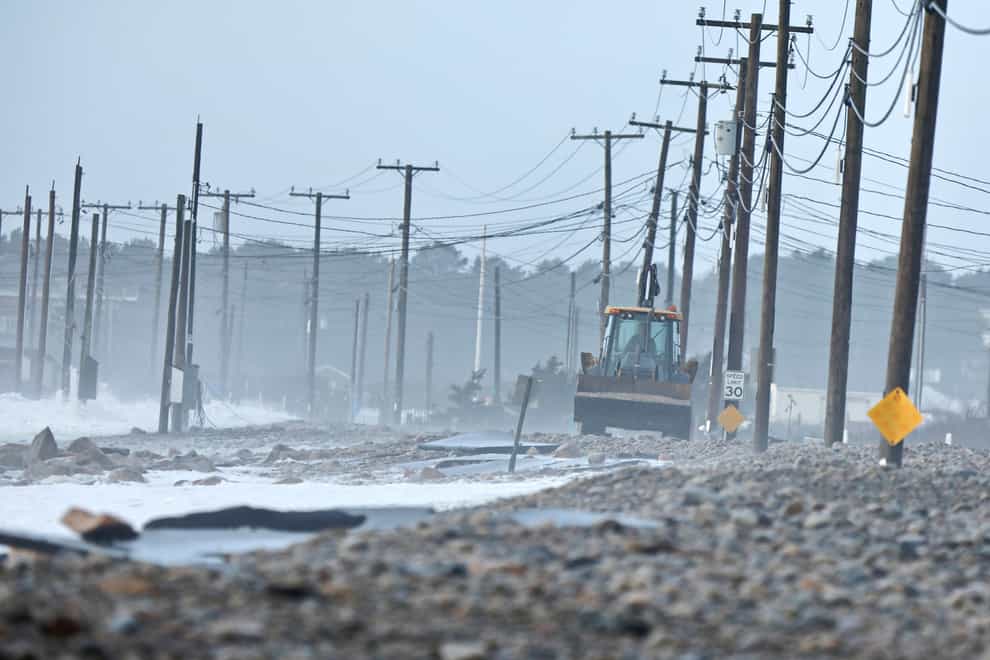 Mountains of sand were washed away leaving exposed rocks in Salisbury (Peter Pereira/The Standard-Times via AP)