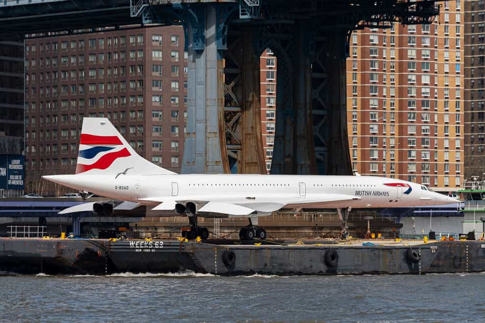 A retired British Airways Concorde supersonic aircraft is transported by barge on the East River in New York. (AP Photo/Peter K. Afriyie)