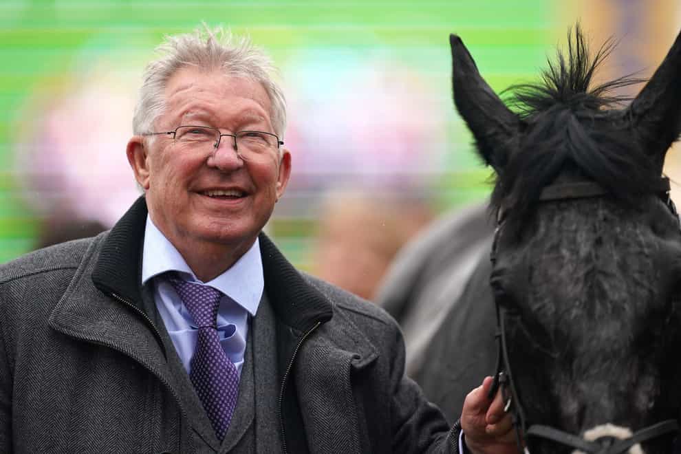 Sir Alex Ferguson (left), owner of Monmiral, celebrates winning the Pertemps Network Final, which was ridden to victory by Harry Cobden on day three of the 2024 Cheltenham Festival at Cheltenham Racecourse. Picture date: Thursday March 14, 2024.