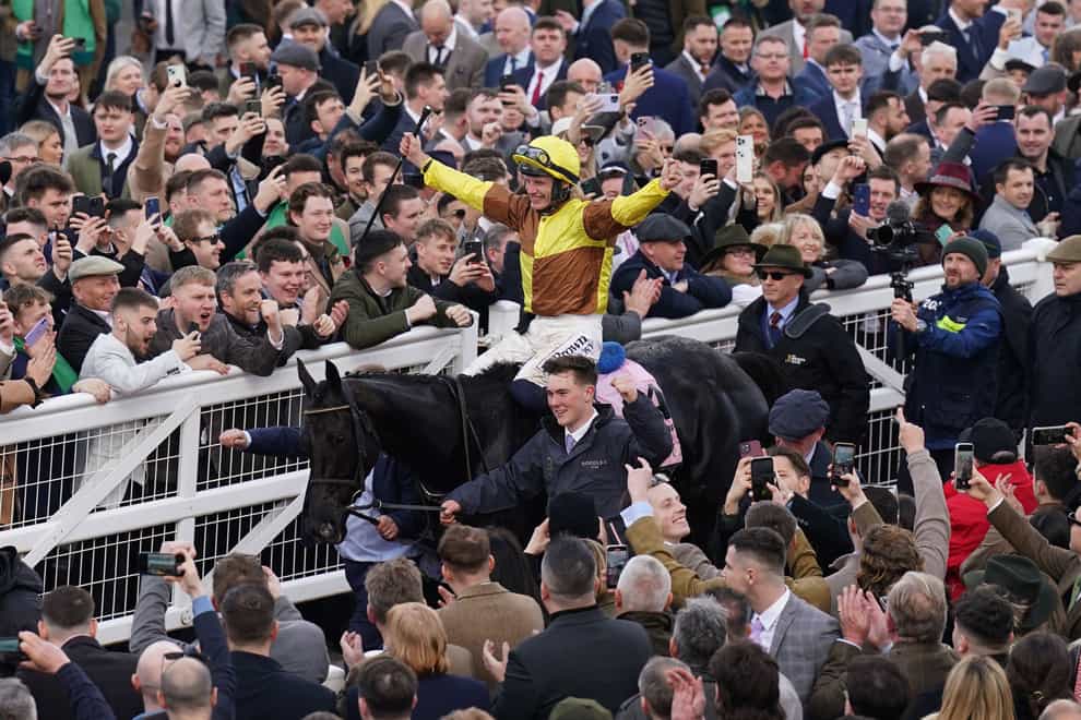 Paul Townend celebrates aboard Galopin Des Champs after winning the Boodles Cheltenham Gold Cup Steeple Chase on day four of the 2024 Cheltenham Festival at Cheltenham Racecourse. Picture date: Friday March 15, 2024.