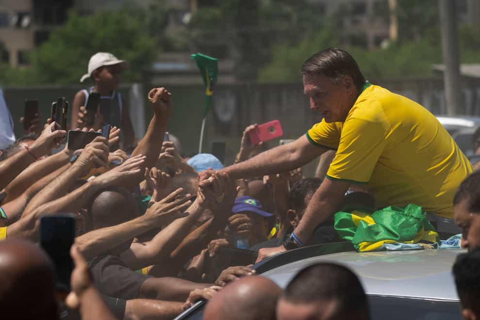 Former Brazil’s President Jair Bolsonaro greets supporters after the launch of a campaign event launching the pre-candidacy of a mayoral candidate in Rio de Janeiro (Silvia Izquierdo/AP)
