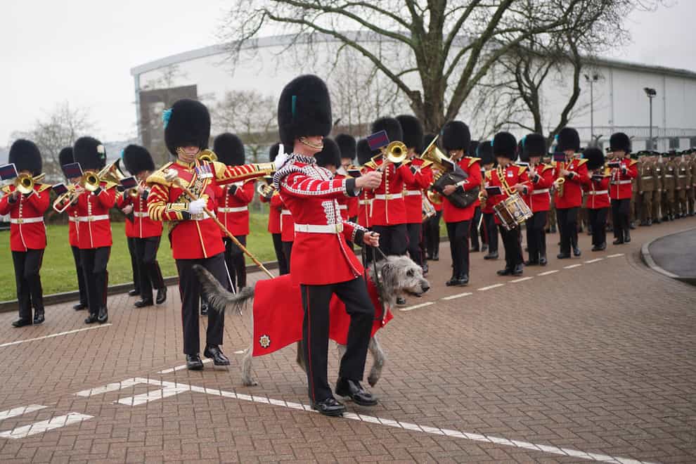 Irish Guardsmen marched on to the Parade Square at Mons Barracks, Aldershot, led by their canine mascot (Yui Mok/PA)
