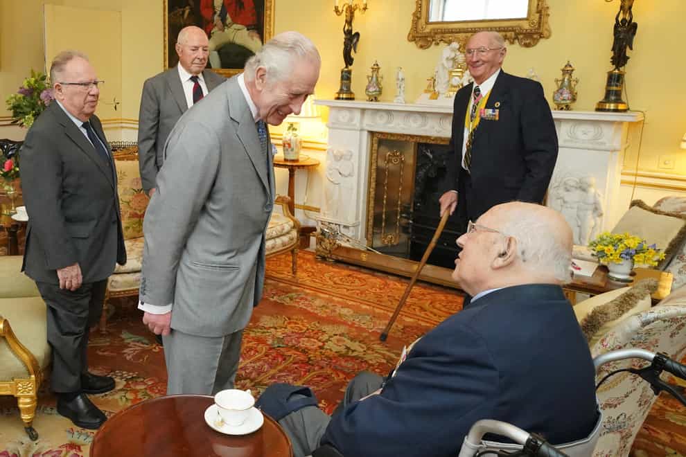 King Charles III during an audience with veterans of the Korean War (left to right) Alan Guy, Mike Mogridge, Brian Parritt, and Ron Yardley, at Buckingham Palace, London on Tuesday (Jonathan Brady/PA)