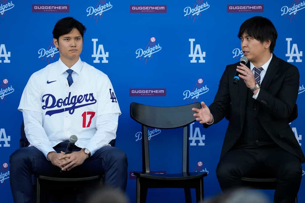 Los Angeles Dodgers’ Shohei Ohtani, left, and interpreter Ippei Mizuhara answer questions during a news conference at Dodger Stadium in December in Los Angeles (Ashley Landis/AP)