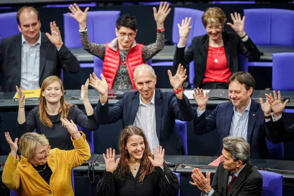Heike Heubach, front centre, the first deaf member of the Bundestag, at the start of a meeting of the German federal parliament at the Reichstag building in Berlin, Germany (Kay Nietfeld/dpa via AP)