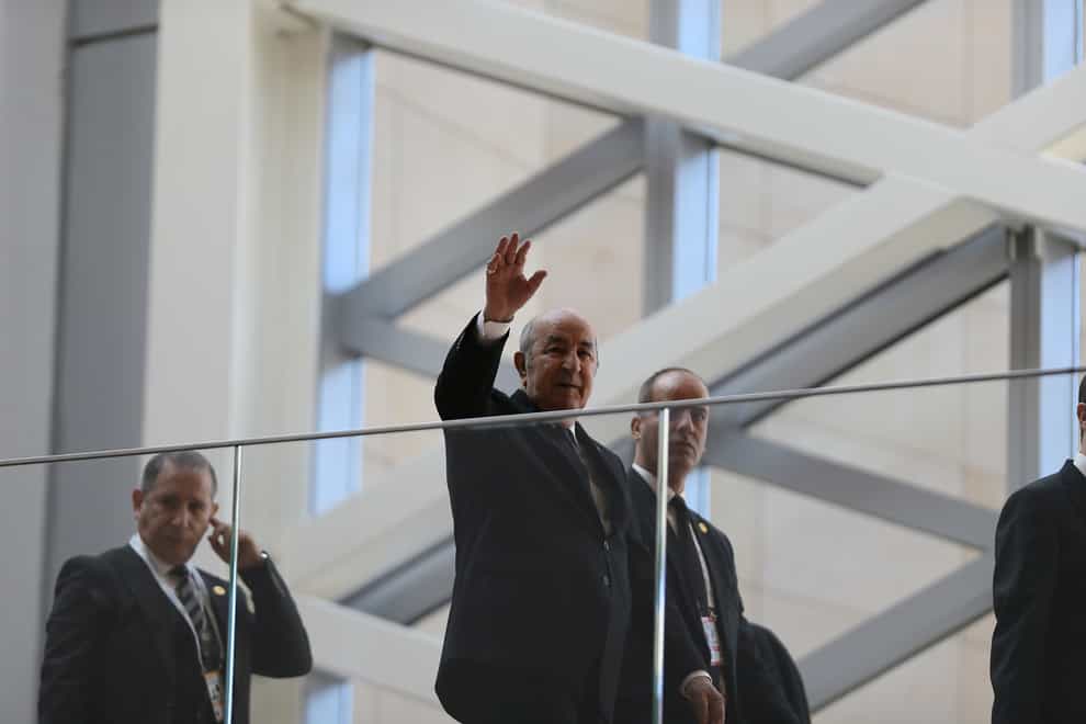 Algerian president Abdelmajid Tebboune waves (Anis Belghoul/AP)
