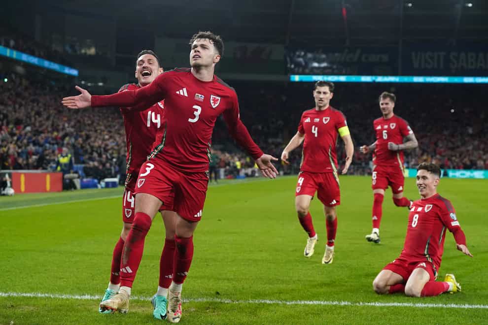 Neco Williams (second left) celebrates after scoring Wales’ second goal in their 4-1 Euro 2024 play-off victory over Finland (Nick Potts/PA)