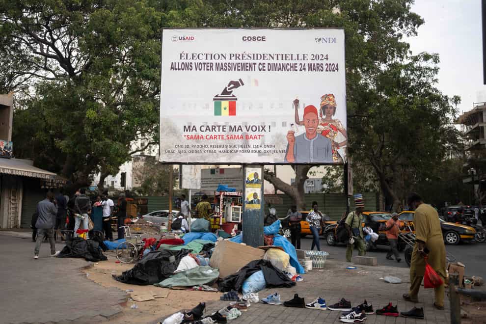 A banner in Dakar encourages people to vote in the presidential election (Mosa’ab Elshamy/AP/PA)