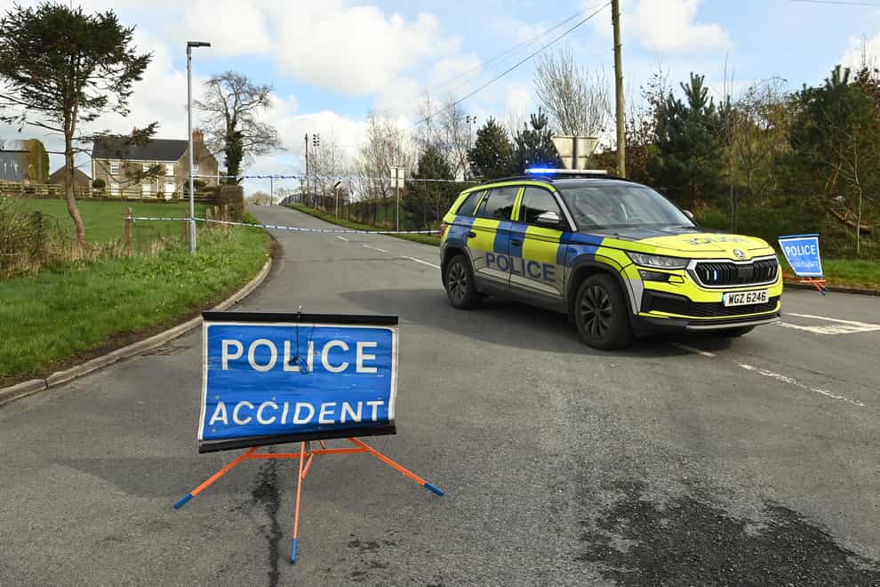 A cordon near the scene on the Ballynahonemore Road in Armagh, where four people have died in a single-vehicle collision (Oliver McVeigh/PA)