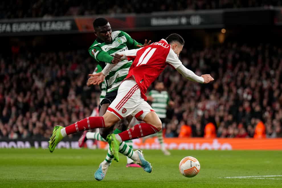 Arsenal’s Gabriel Martinelli (right) and Sporting’s Ousmane Diomande battle for the ball (John Walton/PA)
