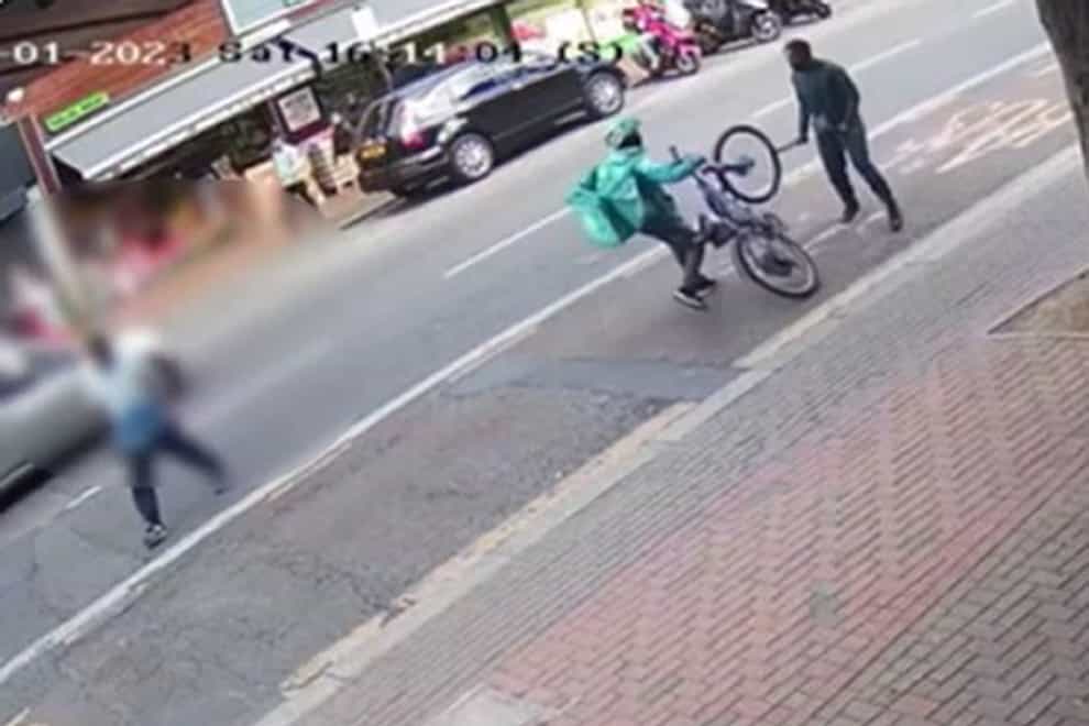 Lewis Livingstone attacking a Deliveroo rider in Fore Street, Enfield (Met Police)