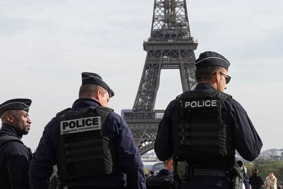 Police officers patrol the Trocadero plaza near the Eiffel Tower in Paris (Michel Euler/AP)