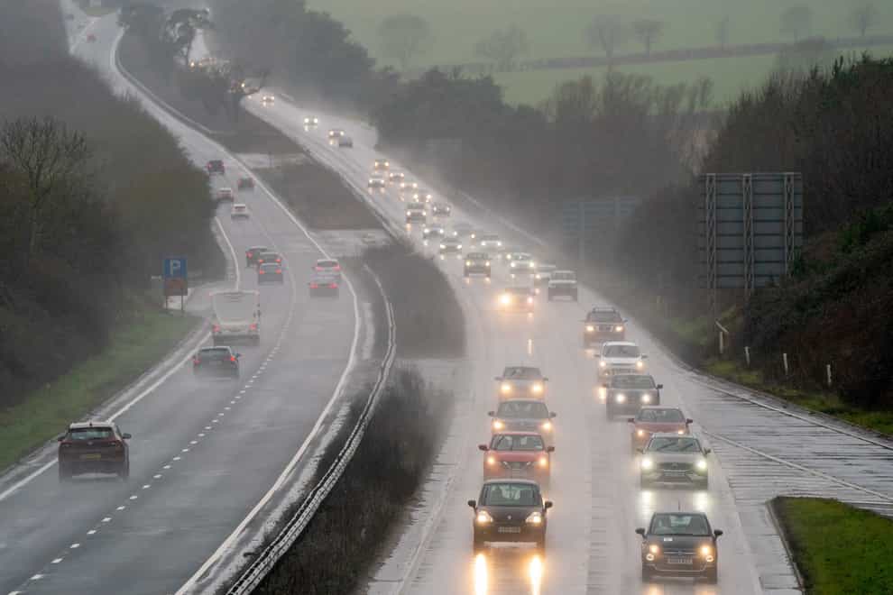 Heavy rain is expected to disrupt more than two million return journeys (Joe Giddens/PA)