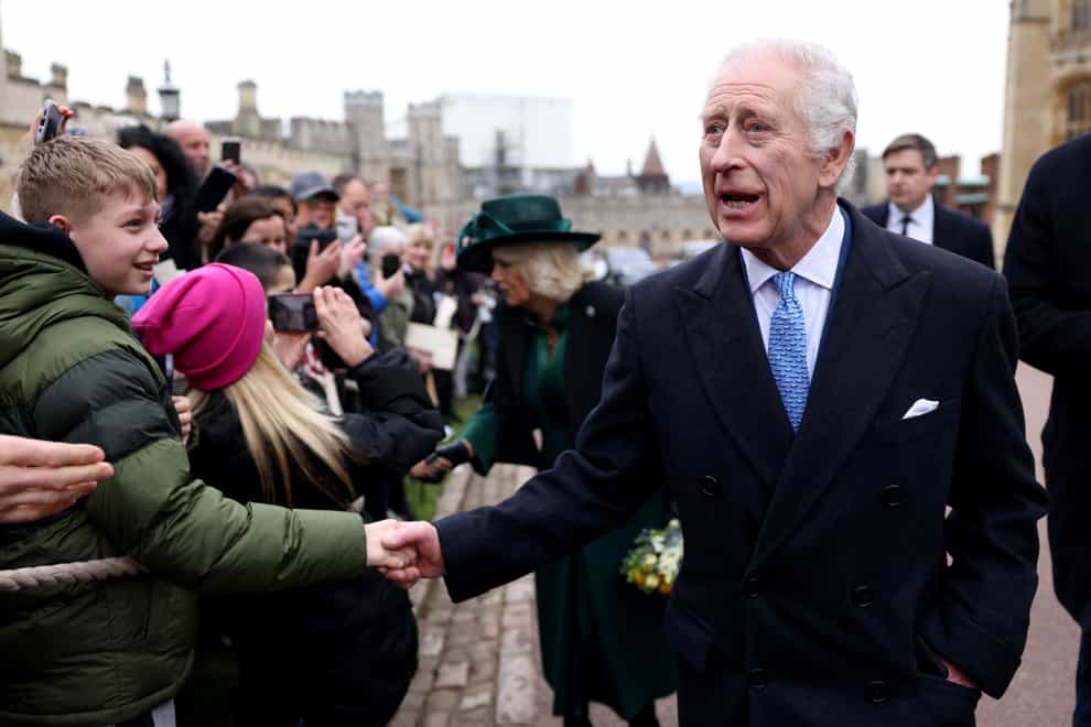 The King was urged to ‘keep going strong’ by a well wisher (Hollie Adams/PA)