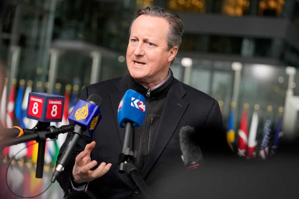 David Cameron has urged allies to spend more on defence during a meeting of Nato foreign ministers in Brussels (Virginia Mayo/AP)