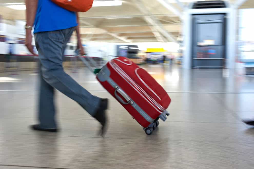 Plans to ease rules around airline passengers carrying liquids and laptops in hand luggage ahead of this summer have been delayed (Alamy/PA)