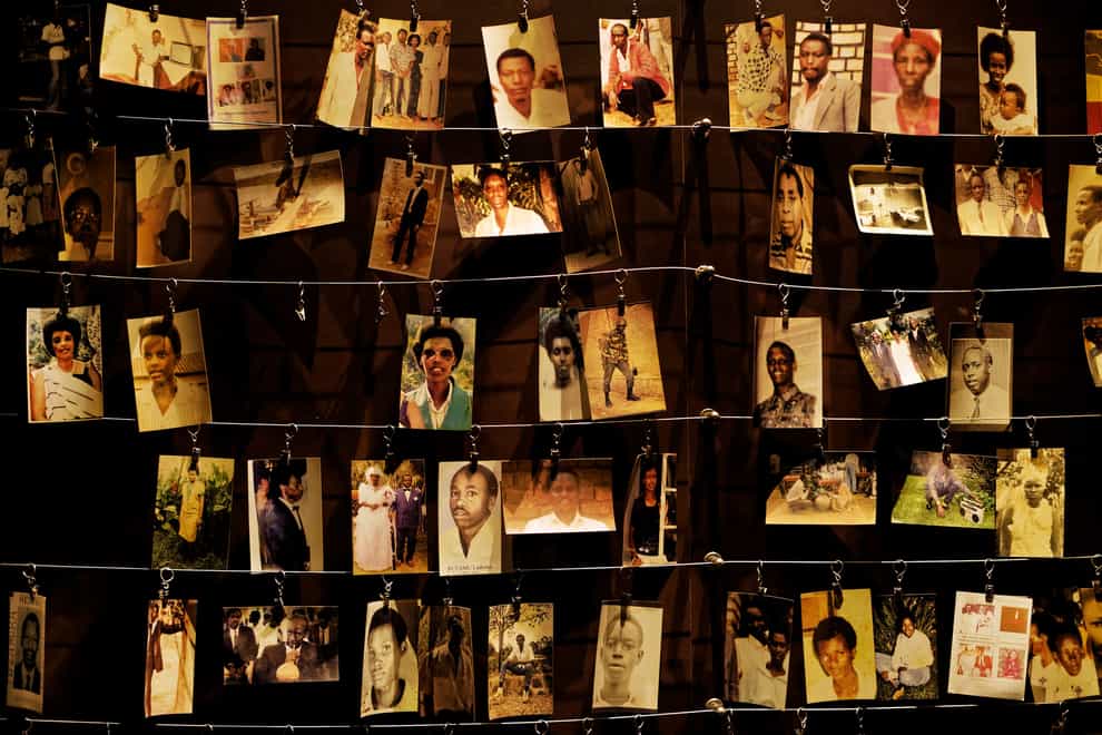 Family photographs of some of those who died hang on display in an exhibition at the Kigali Genocide Memorial centre in the capital Kigali, Rwanda (Ben Curtis/AP)
