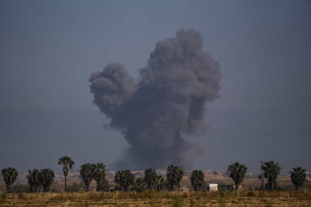Smoke rises to the sky after an explosion in Gaza Strip on Thursday (Leo Correa/AP)
